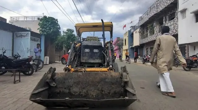 Bulldozer outside the school in Damoh