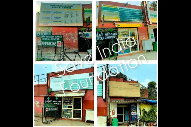 Structures near Jama Masjid with hospital, medical centre and parking signboards